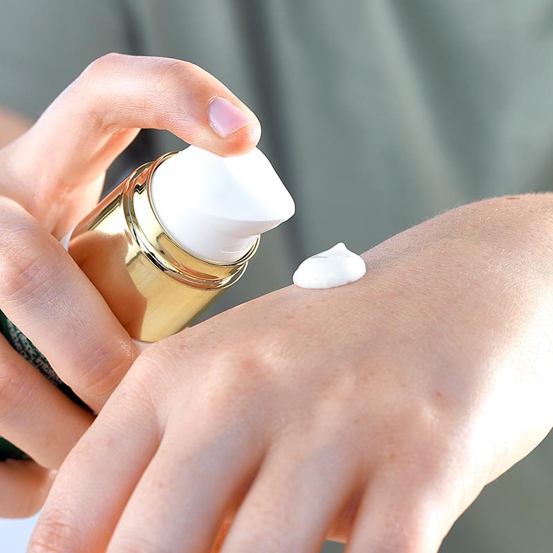 psoriasis treatment, nail and hand cream, Lady applying hand Cream