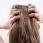 lady scratching a itchy scalp