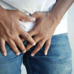 a man holding his privates suffering from genital eczema