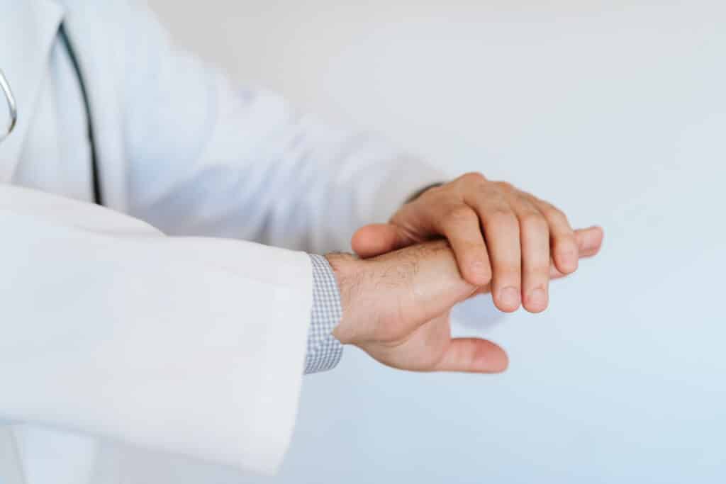doctor examining skin on their own hands