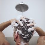 Man washing hair for scalp psoriasis care