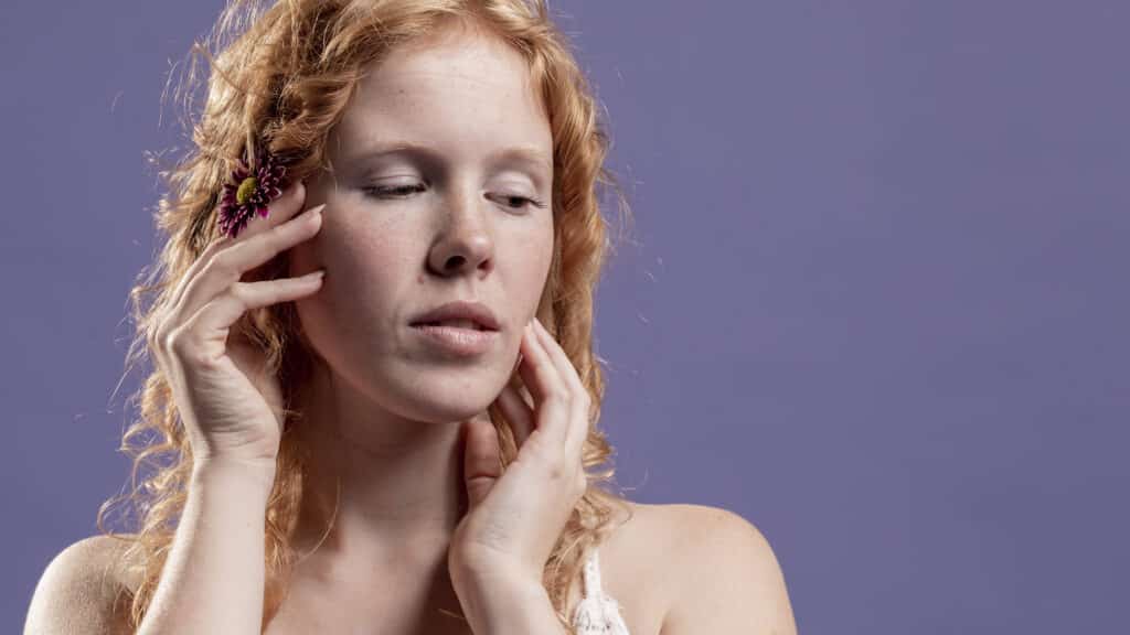 woman with sensitive skin using snail mucin skincare